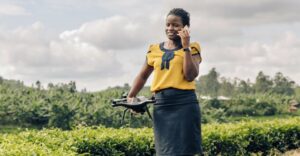 A woman holding a drone at a farm in Uganda. According to technology experts, women in the global South are increasingly being left behind despite an upward trend and growth in digitisation of agriculture. Copyright: CTA ACP-EU (CC BY-SA 2.0)